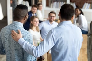 Manager introducing new employee to his team