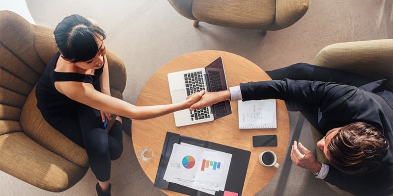 Two business partners shaking hands