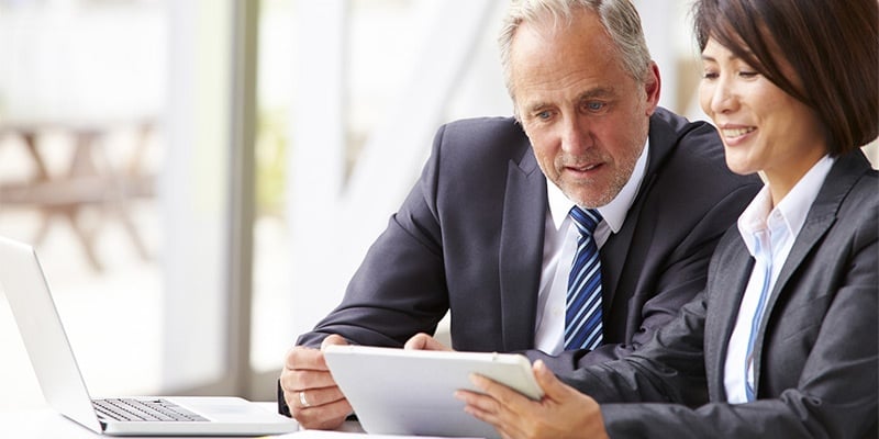 Older man and woman in a business meeting